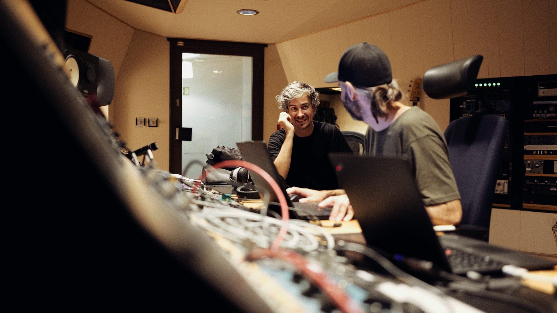 2 people in Soundtrade Studios control room